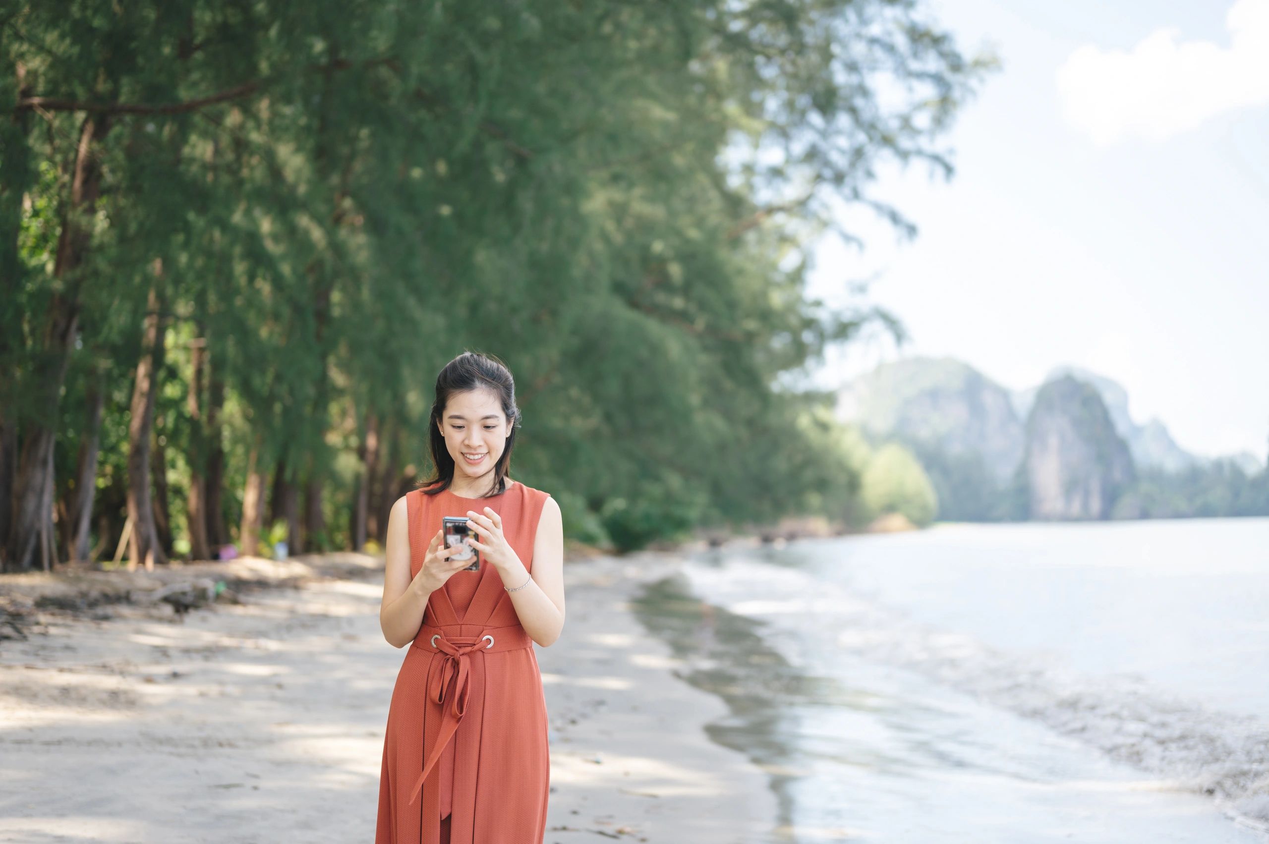 Woman enjoying a tropical beach sunrise